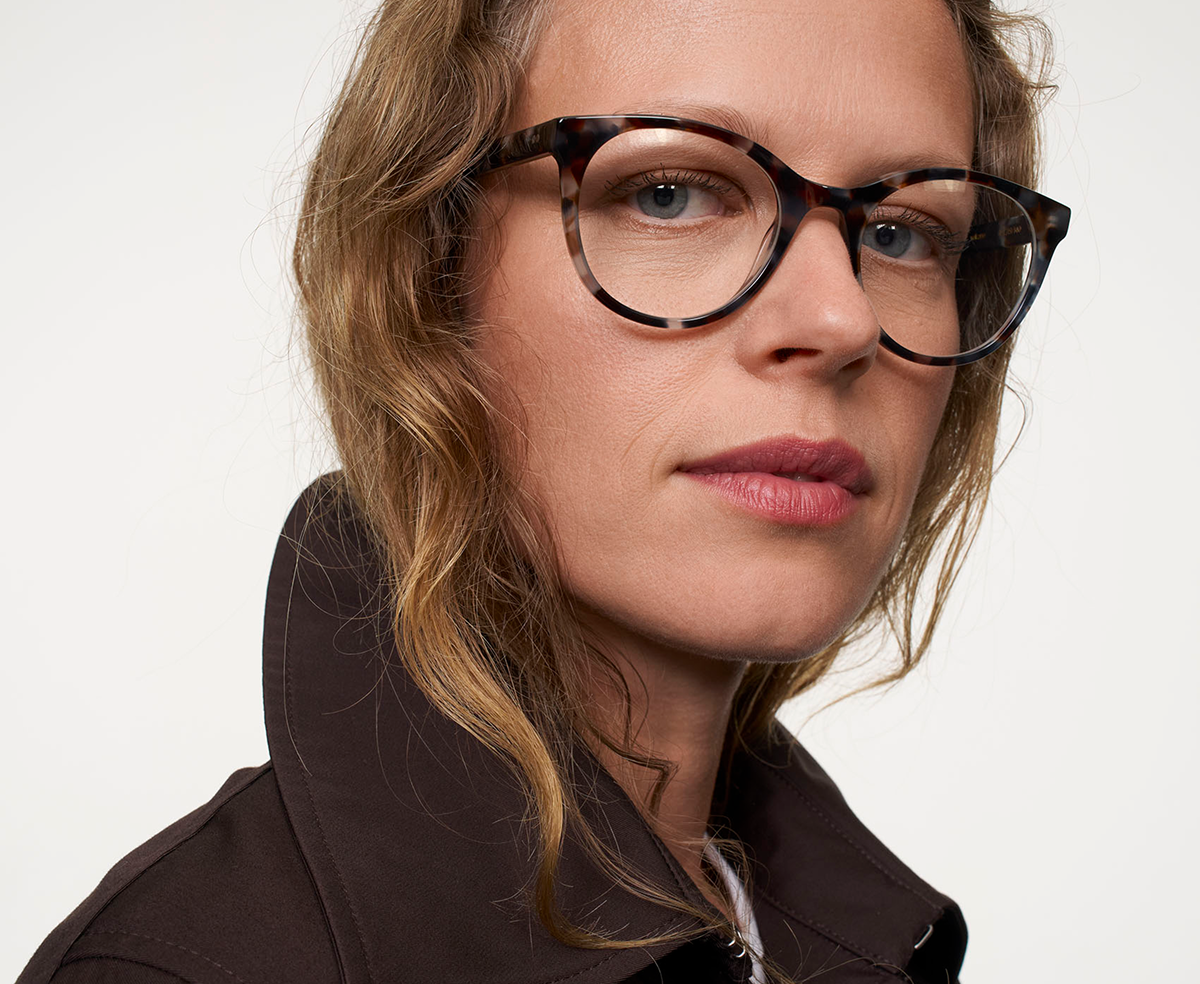Portrait of a woman wearing Ace & Tate glasses